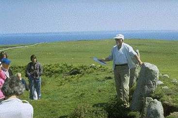 Keith Gardner showing the early Christian stones
to members of the LFS in 1996. (C J Webster).